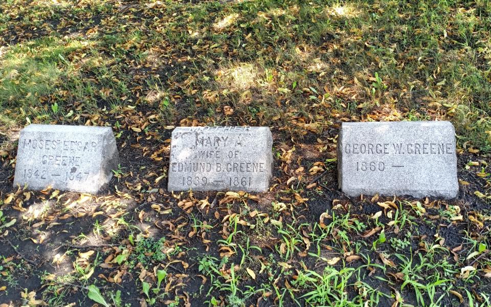 George W. Greene (right) is buried in Elmwood Avenue Cemetery next to his mother, Mary Ann Richardson Greene (middle), and his uncle, Moses Edgar Greene. Mary Ann died when George was approximately a year old, and Moses (not to be confused with George's grandfather Moses Edgar Green Senior) died almost two decades before George was born. George's daughter Nina May is also buried on the family plot -- albeit with no gravestone. The rest of the Greene family are buried elsewhere, as near as Lakeview Cemetery in Burlington to Florida.