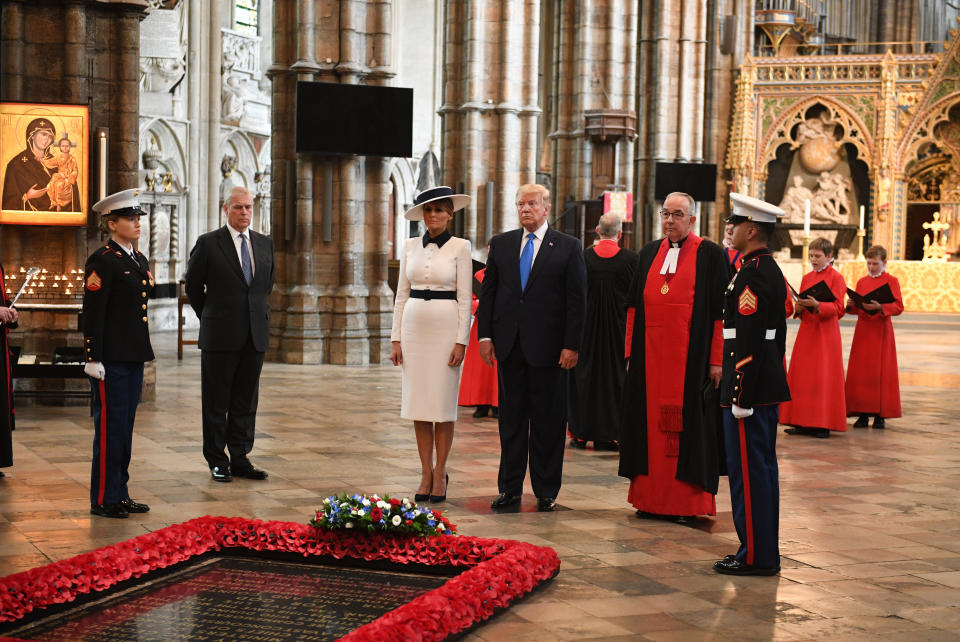 US President Donald Trump, accompanied by his wife Melania and the Duke of York, places a wreath on the Grave of the Unknown Warrior during a tour of Westminster Abbey in central London, on day one of his state visit to the UK.