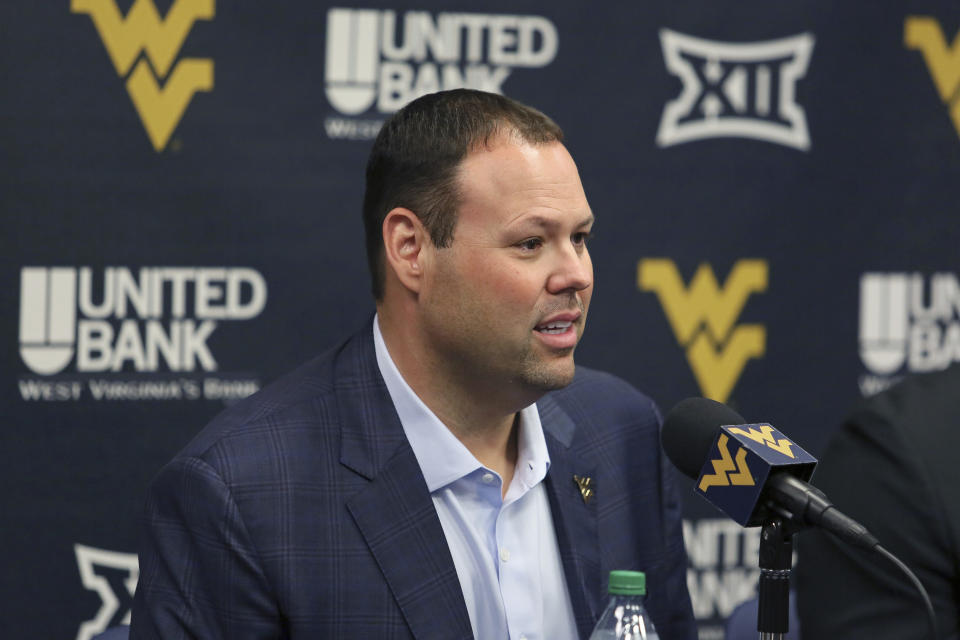 West Virginia athletic director Wren Baker answers questions during a news conference, Monday, June 26, 2023, in Morgantown, W.Va. (AP Photo/Kathleen Batten)