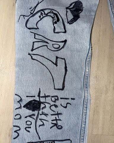 <p>Kim Kardashian/Instagram</p> Kim Kardashian shares a closeup snapshot of her Mother's Day jeans given to her by her kids.