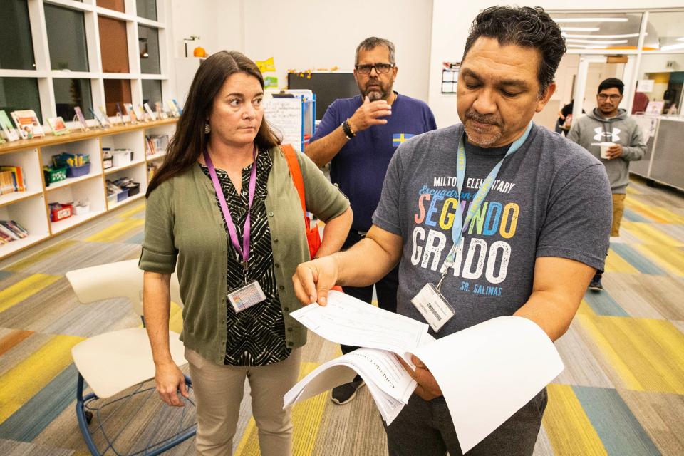 From left, at front, Milton Elementary ESL teachers Jackie (Jacqueline) Wager and Mauricio Salinas give instructions during an English reading class at Milton Elementary School in Milton, Delaware, on Thursday, Oct. 26, 2023.