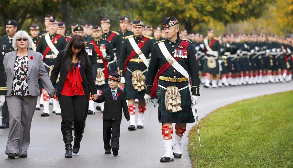 Marcus Cirillo, 5, attends the funeral procession for his father, Cpl. Nathan Cirillo in Hamilton