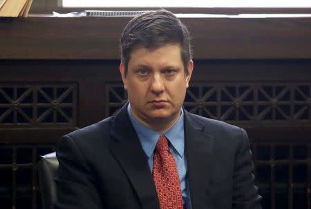 Chicago police officer Jason Van Dyke sits in the courtroom during a hearing in his shooting case of Laquan McDonald at the Leighton Criminal Court Building in Chicago, Illinois March 23, 2016. REUTERS/Nancy Stone/Chicago Tribune/Pool