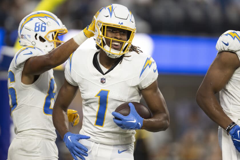 Los Angeles Chargers wide receiver Quentin Johnston (1) smiles after scoring a touchdown during the first half.