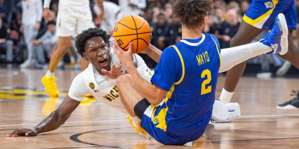 Wichita State’s Quincy Ballard tries to get a loose ball from South Dakota State’s Zeke Mayo during the first half of their game at Intrust Bank Arena on Saturday evening. 