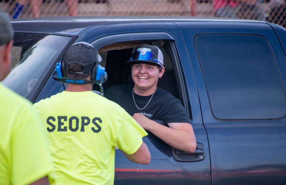 Gage Parsons, of Marietta, is all smiles after attempting to pull in the Workstock Diesel class. Parsons logged a 224.8-foot pull before issues with the front axle knocked him out of contention. For more photos vist www.daily-jeff.com.