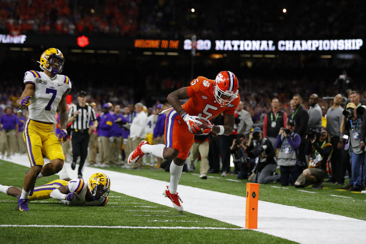 NEW ORLEANS, LOUISIANA - JANUARY 13: Tee Higgins #5 of the Clemson Tigers dives to score a touchdown against the LSU Tigers during the second quarter  in the College Football Playoff National Championship game at Mercedes Benz Superdome on January 13, 2020 in New Orleans, Louisiana. (Photo by Jonathan Bachman/Getty Images)