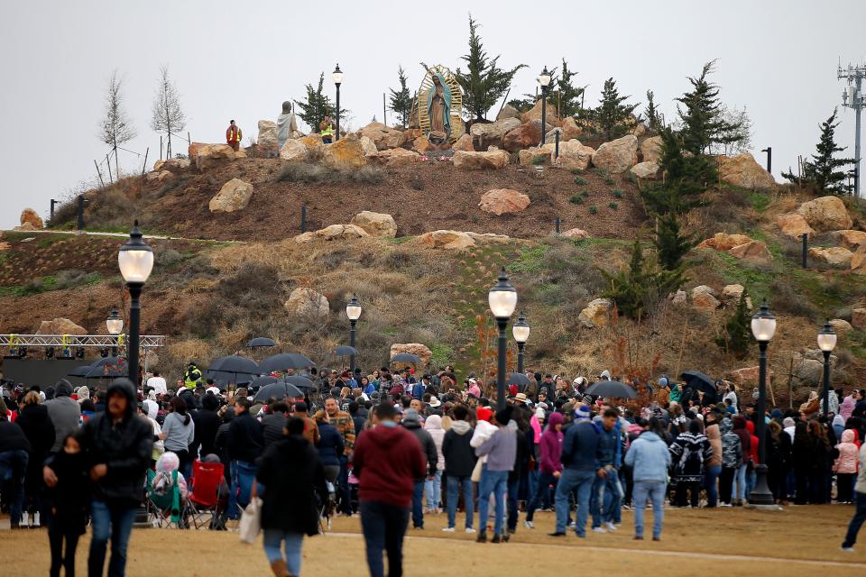 A crowd gathers on Sunday for an outdoor Mass at the bottom of Tepeyac Hill during a dedication for the hill at the Blessed Stanley Rother Shrine in Oklahoma City.
