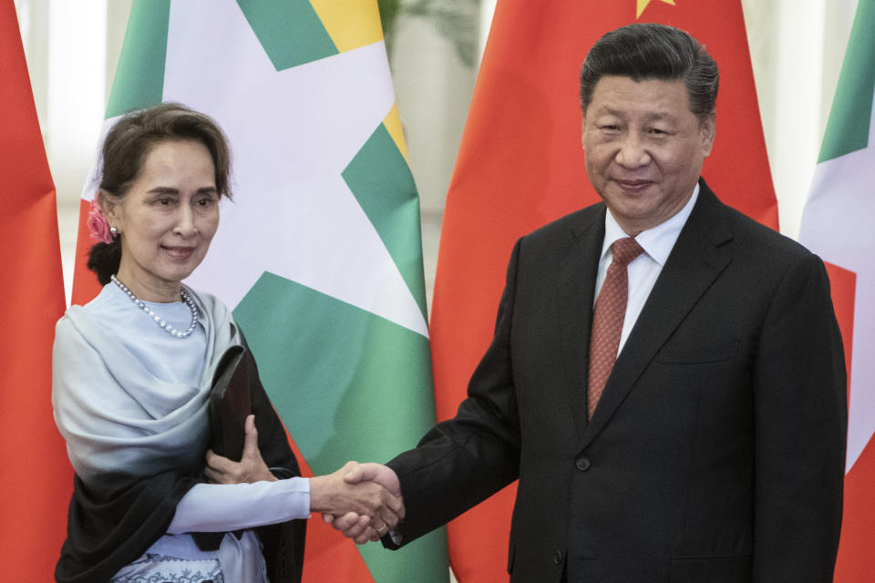 FILE - In this April 24, 2019, file photo, Chinese President Xi Jinping, right, shakes hands with Myanmar State Counsellor Aung San Suu Kyi at the Great Hall of the People in Beijing. The military coup on Monday, Feb. 1, 2021 deposed national leader Aung San Suu Kyi a little over a year after Chinese President Xi Jinping made a show of support to her with the first visit by a head of state from Beijing to Myanmar since 2001 and 33 agreements on a wide range of issues. (Fred Dufour/Pool Photo via AP, File)