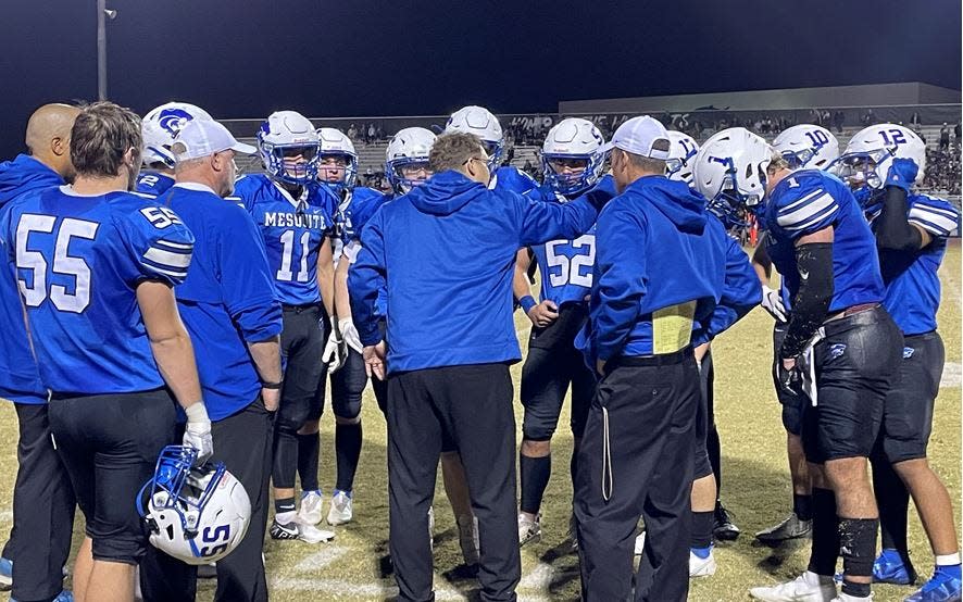 Mesquite players listen to instructions during their first-round playoff game against Benjamin Franklin on Nov. 19, 2021.