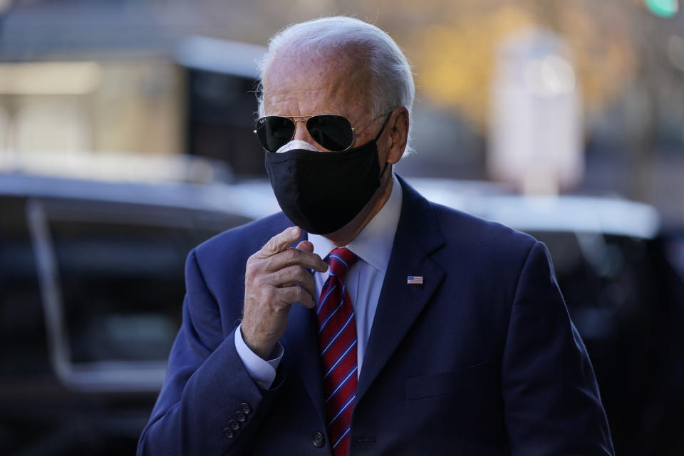 FILE - In this Nov. 23, 2020, file photo President-elect Joe Biden walks from his motorcade to speak to members of the media in Wilmington, Del. The big tech companies enjoyed a cozy relationship with the Obama-Biden administration. Joe Biden is back now, ready to take the presidential mantle in January. But times have changed, and Big Tech is hardly expecting a return to those halcyon days. (AP Photo/Carolyn Kaster, File)