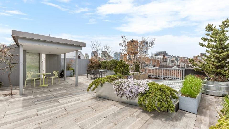 It features a 1,500-square-foot private rooftop terrace with professionally designed gardens. - Credit: Douglas Elliman