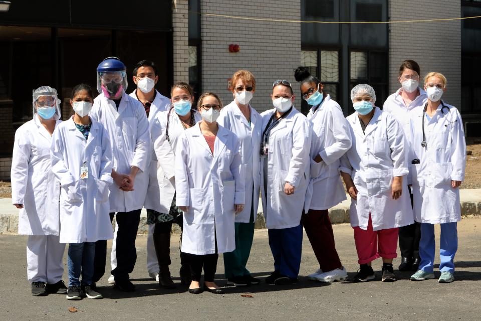 Staff members from Tarrytown Hall Care Center, who are on the frontlines caring for the most vulnerable population, outside the nursing home in Tarrytown April 16, 2020. Nurse practitioner Lisa Kaplewicz, right, spoke about some of the challenges they face when a resident goes out to a medical appointment. "That's a concern because they have the exposure to other people in the community that might potentially be asymptomatic carriers, so we have to presume that there's been an exposure. We have to isolate these residents within our facility to prevent transmission to the other residents that are here," said Kaplewicz.