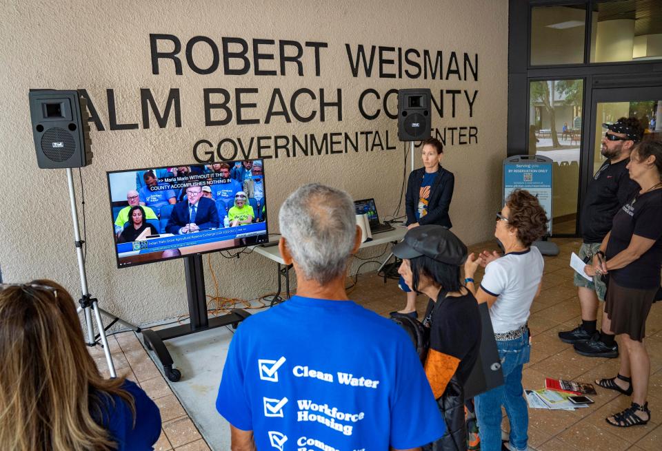 An overflow crowd listens to the Palm Beach County Commison meeting outside the governmental center in West Palm Beach, Florida on October 24, 2023. County commissioners rejected a GL Homes' land swap proposal to build a 1,000 unit high-end development on preserved land in the Ag Reserve.