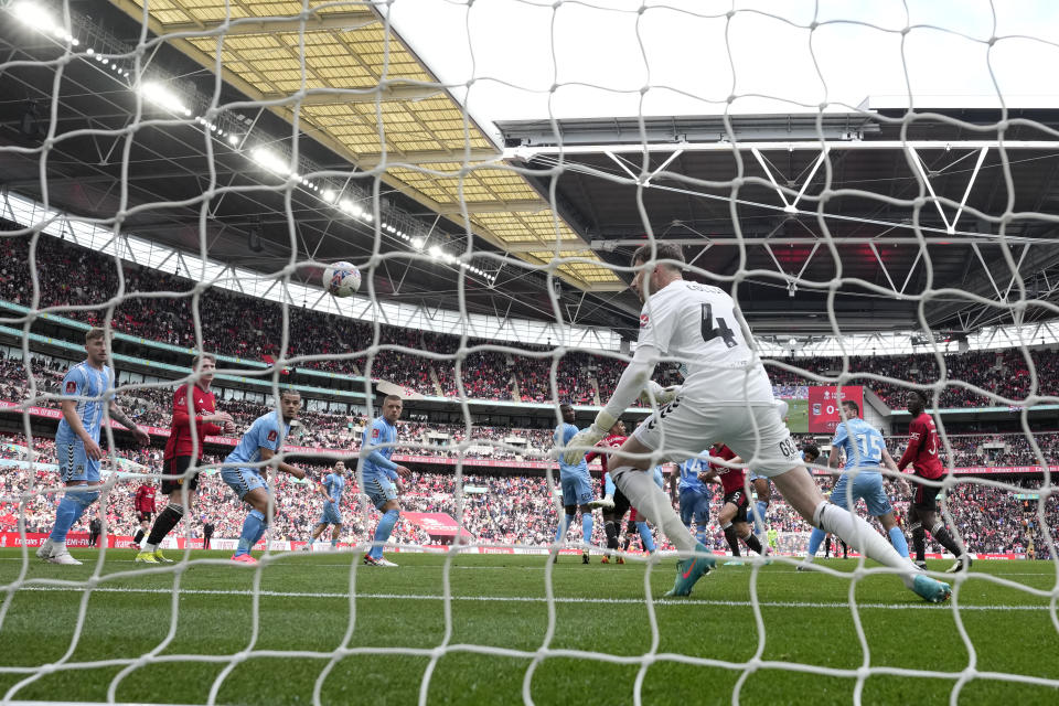 Coventry City's goalkeeper Bradley Ray Collins fails to save the goal from Manchester United's Harry Maguire during the English FA Cup semifinal soccer match between Coventry City and Manchester United at Wembley stadium in London, Sunday, April 21, 2024. (AP Photo/Alastair Grant)