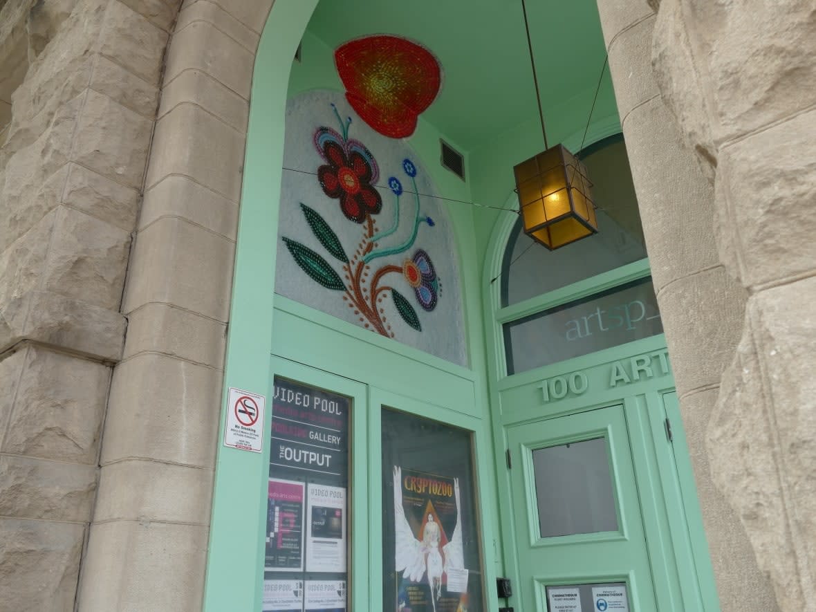 Bronwyn Butterfield's art, inspired by her great-grandmother's design, is displayed in one of the entryways of the Artpace building in Winnipeg's Exchange District.   (Darin Morash/CBC - image credit)