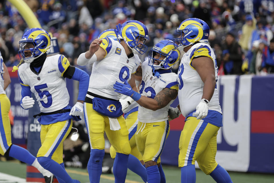 Los Angeles Rams running back Kyren Williams (23) celebrates with quarterback Matthew Stafford (9) after running in a touchdown during the second half an NFL football game against the New York Giants, Sunday, Dec. 31, 2023, in East Rutherford, N.J. (AP Photo/Adam Hunger)
