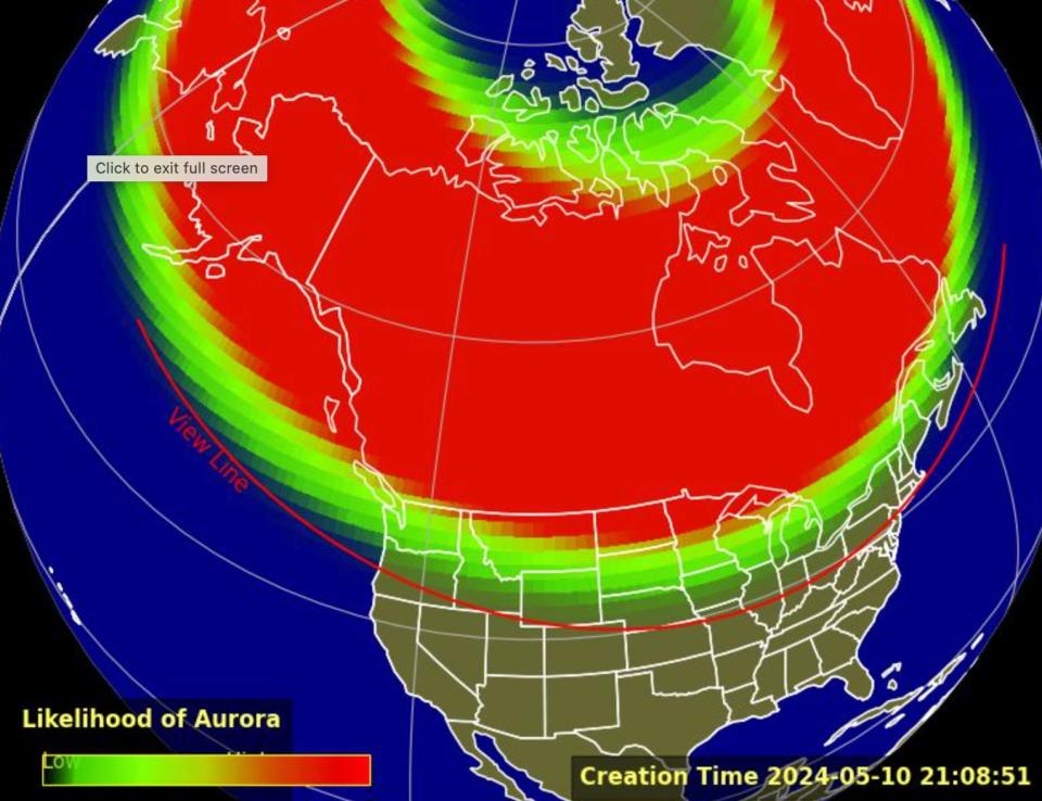 map of globe showing red and green bands where aurora borealis are most likely to be seen