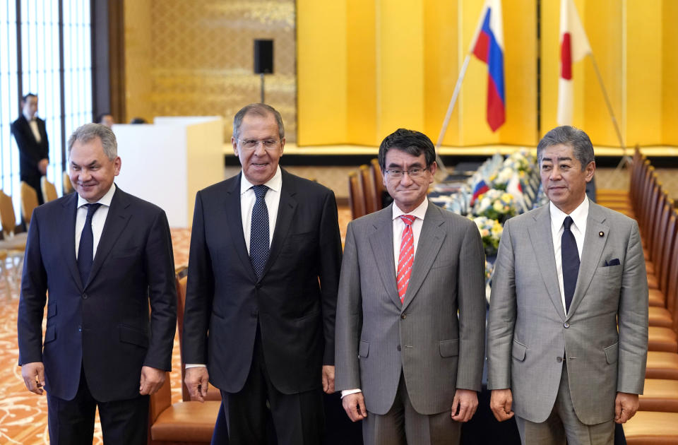 Japanese Foreign Minister Taro Kono, second from right, and Defense Minister Takeshi Iwaya, right, pose with Russian Foreign Minister Sergei Lavrov, second from left, and Defense Minister Sergei Shoigu for a photo prior to their meeting at the Iikura guest house in Tokyo Thursday, May 30, 2019. They hold meetings amid lack of progress on settling island disputes. (Franck Robichon/Pool Photo via AP)