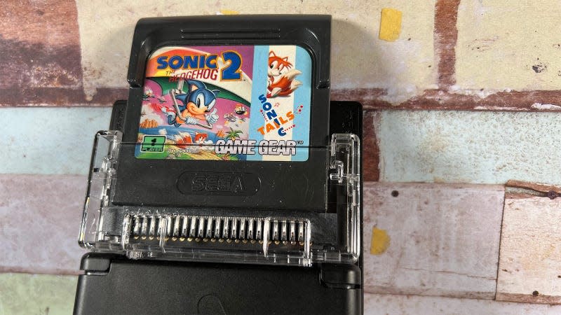 An Analogue Pocket with the Game Gear adapter and a copy of Sonic 2 inserted. 