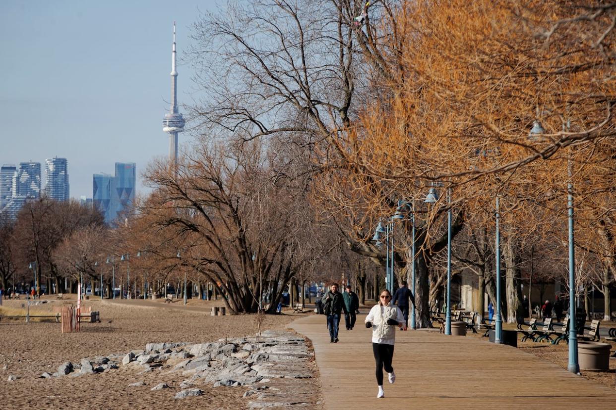 Torontonians enjoy an exceptionally warm February day in the city. (Evan Mitsui/CBC - image credit)