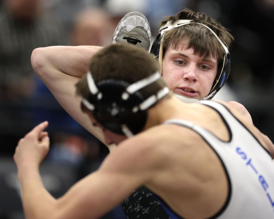 Logan’s Cooper Redd wrestles Stansbury’s Lorenzo Call in the 4A Wrestling State Championships at the UCCU Center in Orem on Friday, Feb. 16, 2024. | Laura Seitz, Deseret News