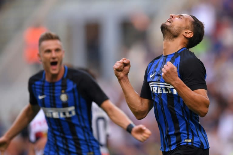 Inter Milan's defender Danilo D'Ambrosio celebrates after scoring against Genoa on September 24, 2017 at the San Siro stadium in Milan