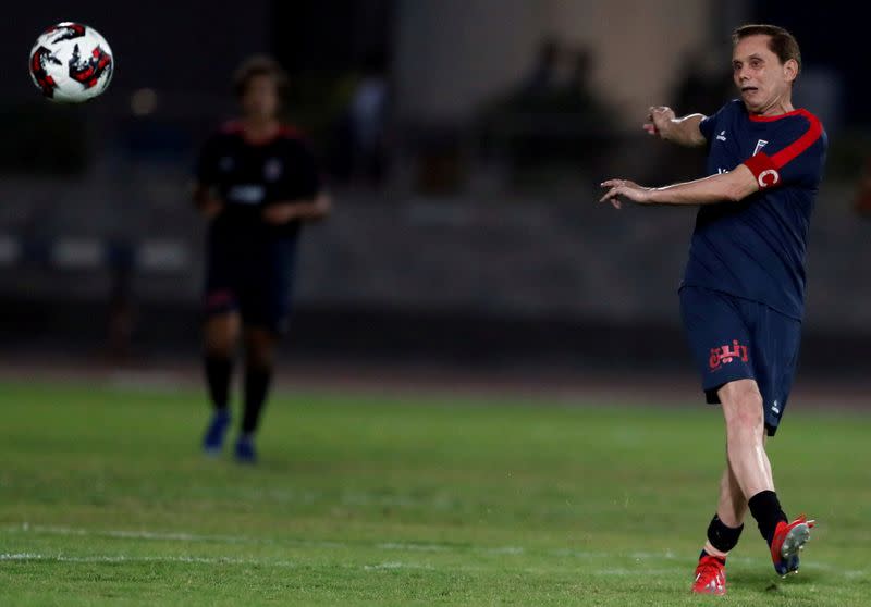 Ezzeldin Bahader, a 74-years-old Egyptian football player of 6th October Club is seen in action during a soccer match against El Ayat Sports Club of Egypt's third division league at the Olympic Stadium in the Cairo suburb of Maadi