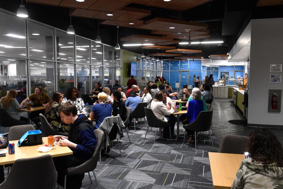 Employees eat lunch in the company cafeteria at the Abilene Blue Cross Blue Shield office May 17.