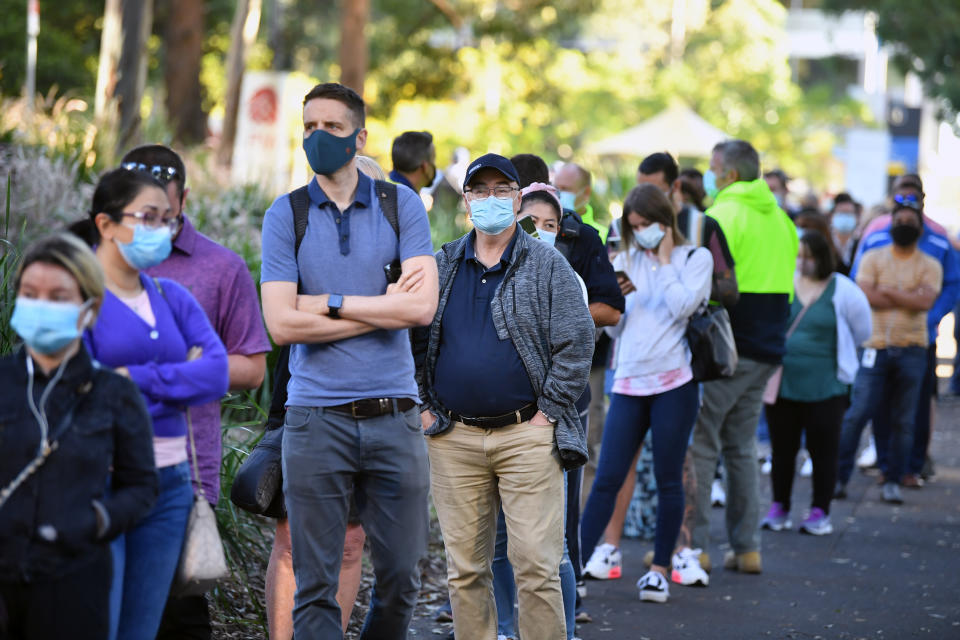 A queue forms outside at a mass Covid-19 vaccination hub in Sydney, Monday.