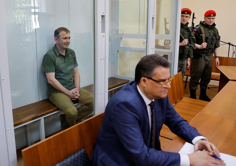 Major General Ivan Popov, arrested on suspicion of fraud, attends a hearing at the military court in Moscow