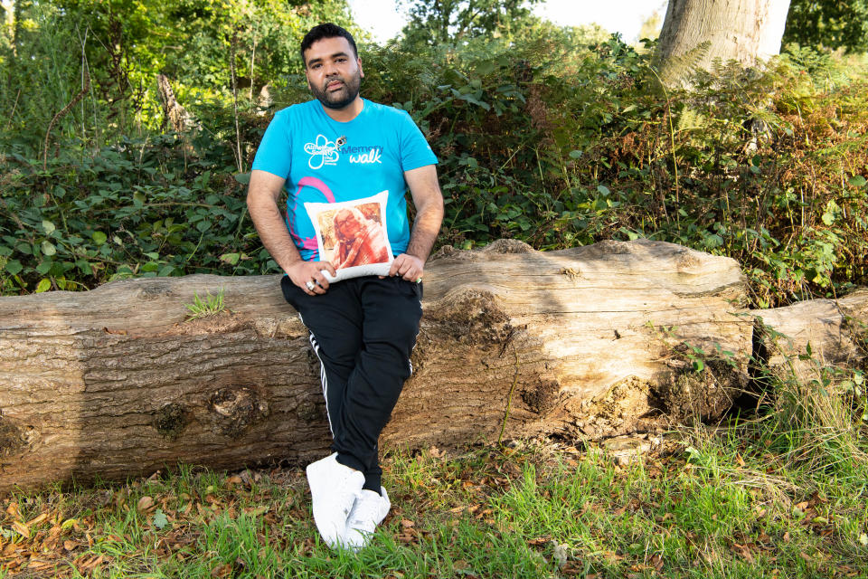 LONDON, ENGLAND - AUGUST 21: Naughty Boy holds an image of his mother who suffers from vascular dementia, during a Memory Walk on August 21, 2020 in London, England. Memory Walk is Alzheimer's Society's series of sponsored walks to raise money for the charity.  (Photo by Jeff Spicer/Getty Images)