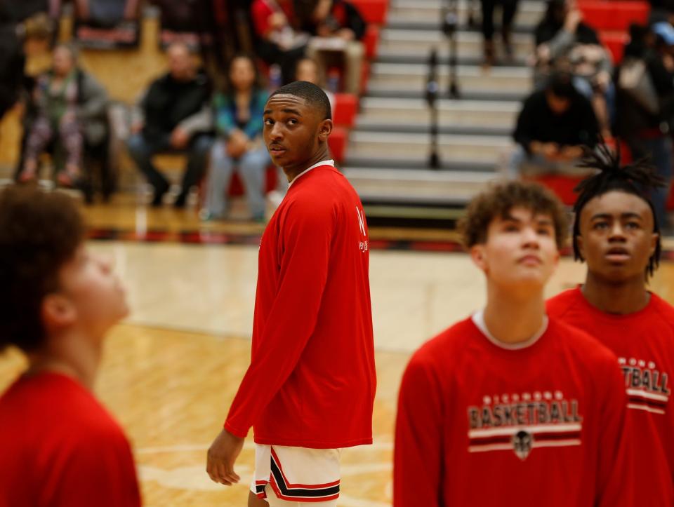 Richmond senior Stephan Douglas looks back at one of the final shots of warmups before a game against Kokomo Feb. 11, 2022.