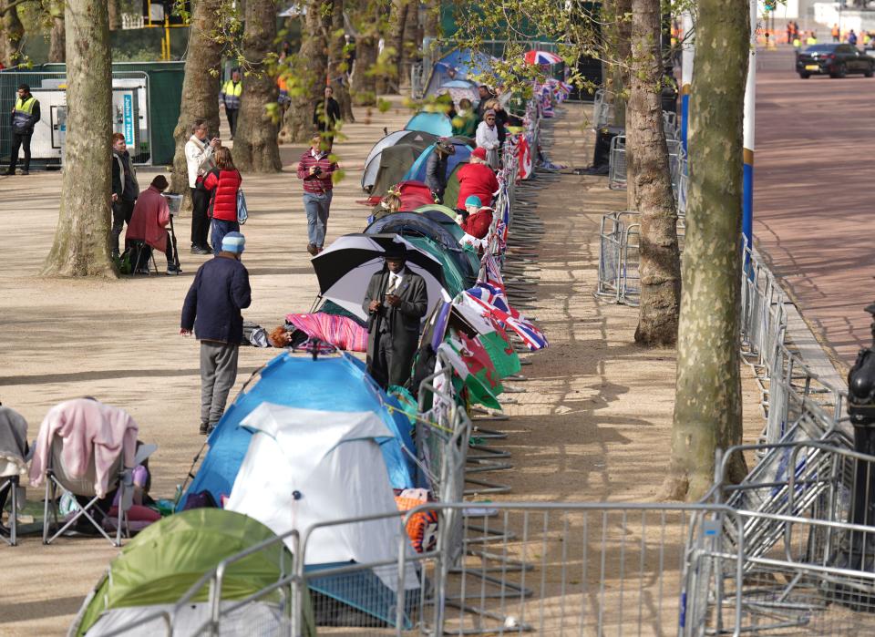 Royal fans camping out on The Mall, near Buckingham Palace in central London, ahead of the coronation of King Charles III and the Queen Consort. Picture date: Thursday May 4, 2023.