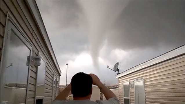 Oil worker Abram Schiff stands amazed at the tornado moving in on his home. Source: Dan Yorgason/Youtube