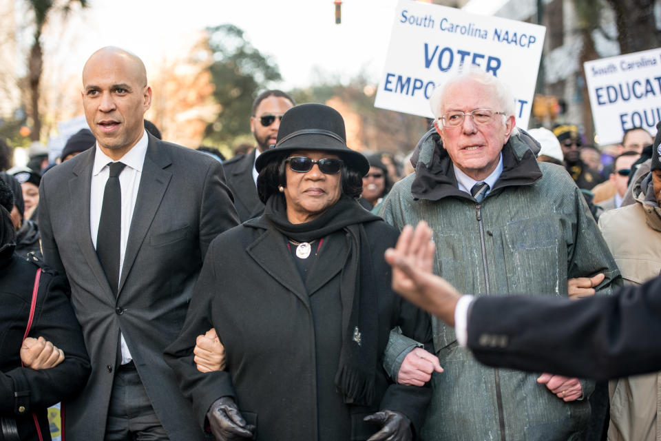 Sen. Cory Booker (D-N.J.), left,&nbsp;and Sen. Bernie Sanders (I-Vt.) attend an NAACP rally in South Carolina, a sign of how important&nbsp;black voters will be to securing the Democratic presidential nomination in 2020. They walked with&nbsp;Brenda Murphy, president of the state's NAACP chapter. (Photo: Sean Rayford via Getty Images)