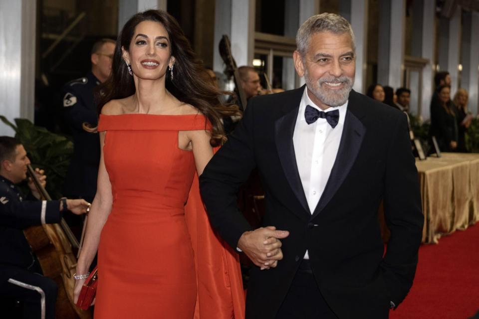 Mandatory Credit: Photo by Ron Sachs/UPI/Shutterstock (13648246a) George Clooney and his wife, Amal arrive for the formal Artist's Dinner honoring the recipients of the 45th Annual Kennedy Center Honors at the Department of State in Washington, D.C. on Saturday, December 3, 2022. The 2022 honorees are: actor and filmmaker George Clooney contemporary Christian and pop singer-songwriter Amy Grant legendary singer of soul, Gospel, R&B, and pop Gladys Knight, Cuban-born American composer, conductor, and educator Tania León and iconic Irish rock band U2, comprised of band members Bono, The Edge, Adam Clayton, and Larry Mullen Jr. 45th Annual Kennedy Center Honors Formal Artist's Dinner Arrivals, Washington, District of Columbia, United States - 03 Dec 2022