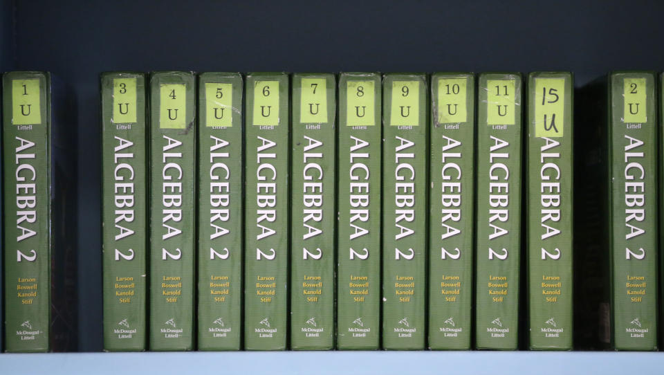 Algebra II books sit lined up in a high school math class at Flower Mound High School in Flower Mound, Texas, Wednesday, Jan. 15, 2014. Texas became the first state to require its high school students to take algebra II, betting tougher graduation standards would better prepare its youngsters for college and life beyond it. Since then, 16 other states and the District of Columbia have followed suit, and two more will by 2020. But Texas is now bucking the trend it began, abandoning advanced-math mandates to give high school students more flexibility to focus on vocational training for jobs that pay top dollar but don’t necessarily require a college degree. (AP Photo/LM Otero)