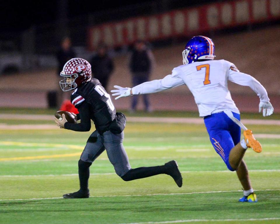 Patterson quarterback Max Medina (3) scrambles out of the pocket to escape pressure during a Division IV Sac Joaquin Section Football Playoff game between Patterson and Kimball at Patterson High School in Patterson CA on November 10, 2023.