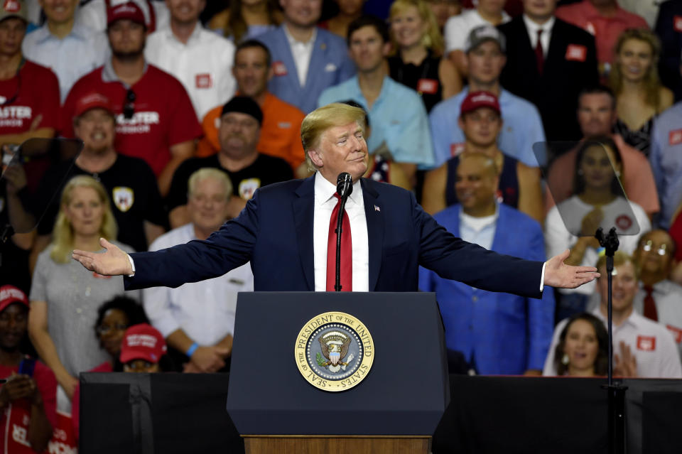 President Donald Trump, in town to support Gov. Henry McMaster, speaks to the crowd at Airport High School, Monday, June 25, 2018, in West Columbia, S.C. (AP Photo/Richard Shiro)