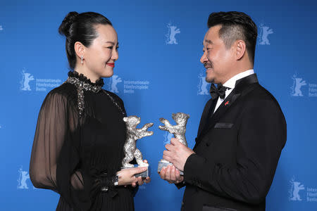 Actors Yong Mei and Wang Jingchun pose with Silver Bears for Best Actor and Actress for Di jiu tian chang (So Long, My Son), after the awards ceremony at the 69th Berlinale International Film Festival in Berlin, Germany, February 16, 2019. Christoph Soeder/Pool via Reuters