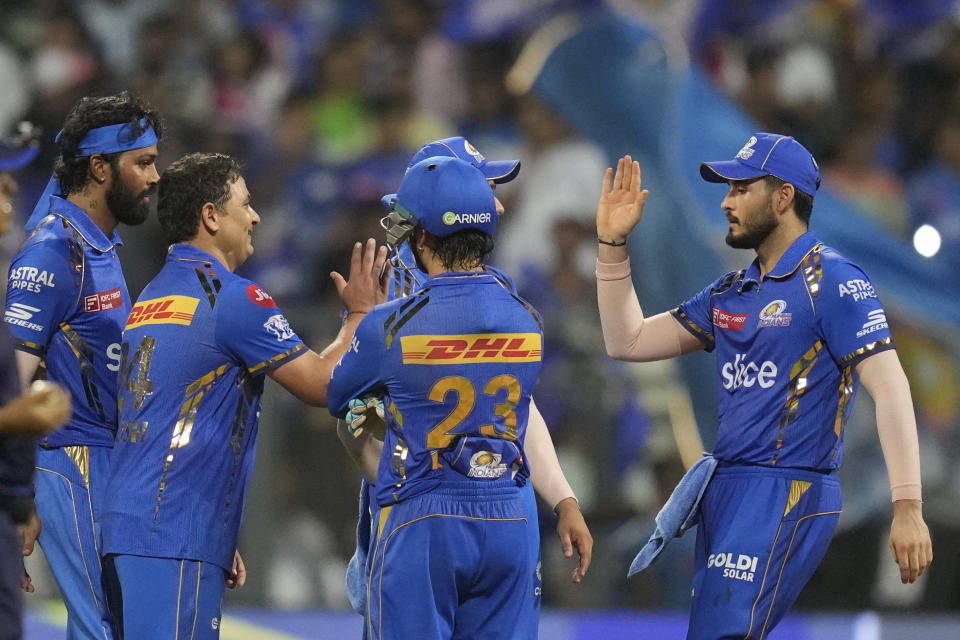 Mumbai Indians' Piyush Chawla , second from left, celebrates the dismissal of Lucknow Super Giants' captain KL Rahul during the Indian Premier League cricket match between Mumbai Indians and Lucknow Super Giants in Mumbai, India, Friday, May 17, 2024.(AP Photo/ Rafiq Maqbool)