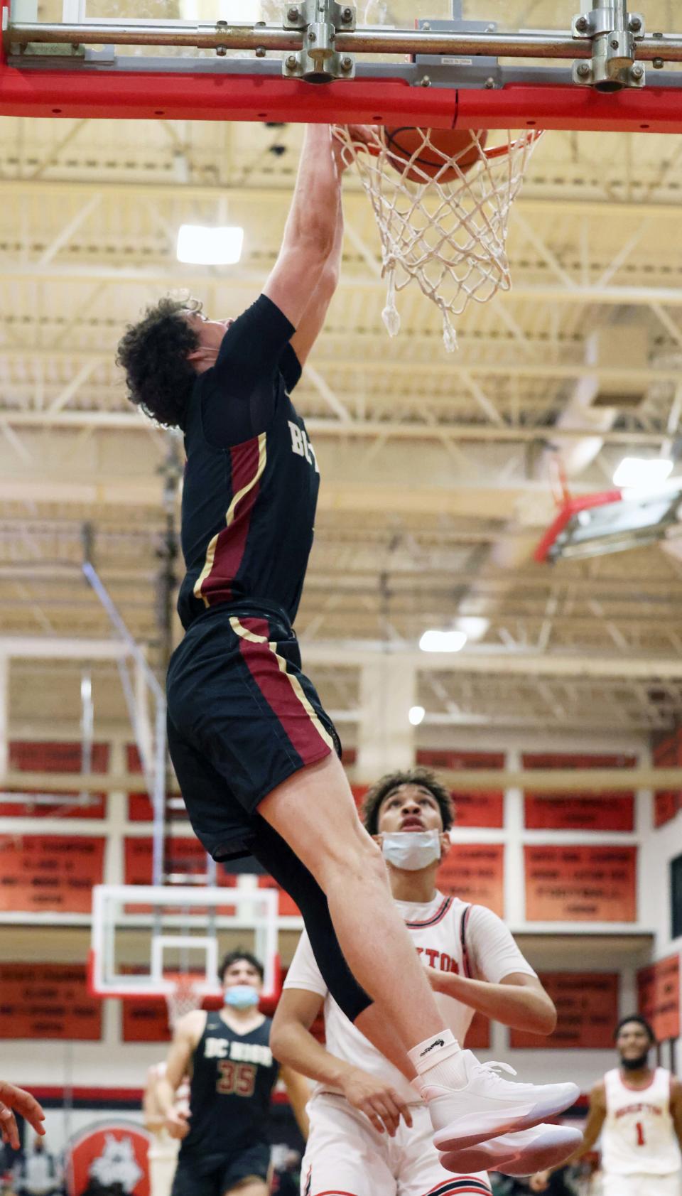 BC High's Mike Loughnane dunks the basketball during a game against Brockton on Friday, Dec. 17, 2021.