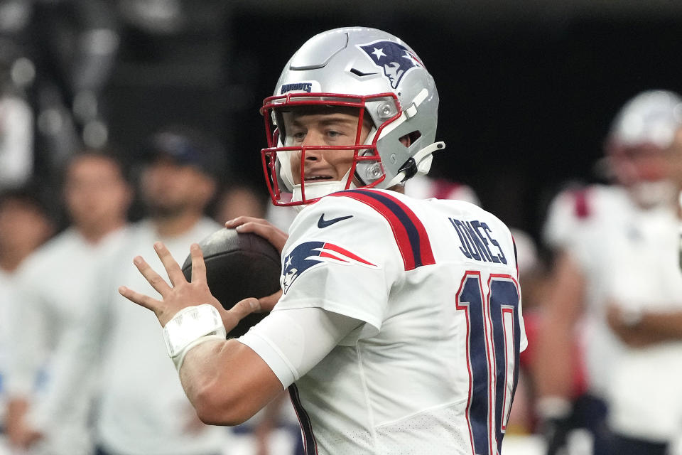 FILE - New England Patriots quarterback Mac Jones (10) throws against the Las Vegas Raiders during the first half of an NFL preseason football game, Friday, Aug. 26, 2022, in Las Vegas. Tua Tagovailoa and Mac Jones will be forever linked by their time as Alabama teammates. Now, for the second consecutive year, they'll meet in Week 1 of the NFL season. (AP Photo/Rick Scuteri, File)