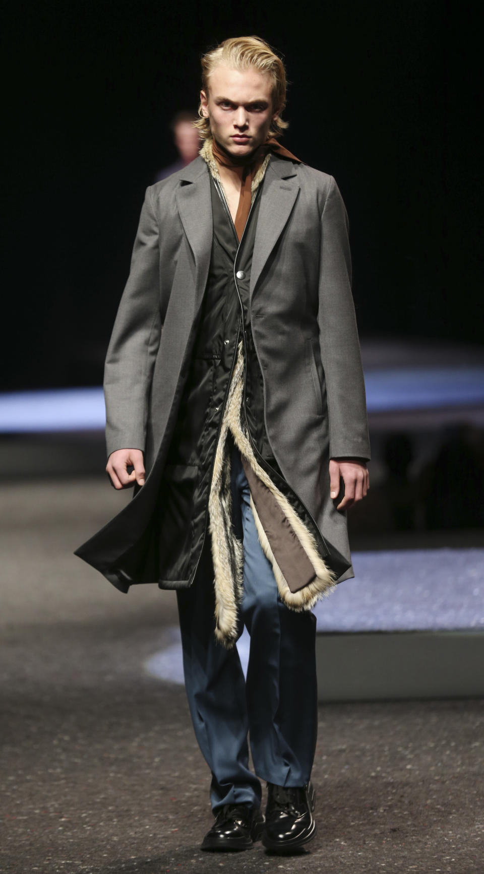 A model wears a creation for Prada men's Fall-Winter 2014 collection, part of the Milan Fashion Week, unveiled in Milan, Italy, Sunday, Jan.12, 2014. (AP Photo/Luca Bruno)