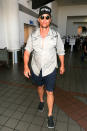 <p>McConaughey was looking a little less pulled together than usual when he touched down at Los Angeles International Airport, but we know he was still, “alright.” It’s right there on his hat. (Photo: starzfly/Bauer-Griffin/GC Images) </p>