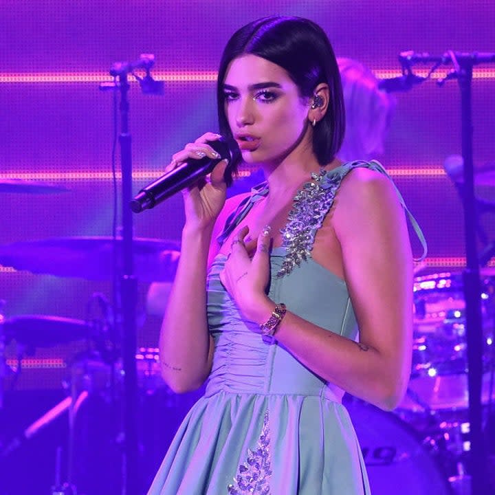 Dua Lipa singing onstage 