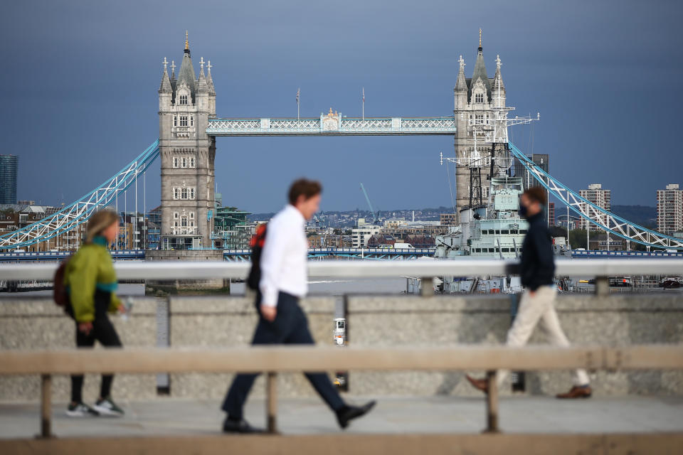 LONDON, ENGLAND - SEPTEMBER 24: Commuters cross London Bridge on September 24, 2020 in London, England. The Chancellor of the Exchequer , Rishi Sunak, announced the government's Support For Jobs plan in the House of Commons today. Beginning in November when the current furlough scheme ends, the government will subsidise the pay of employees who are working fewer hours due to lower demand. Support For Jobs will run for six months. (Photo by Hollie Adams/Getty Images)