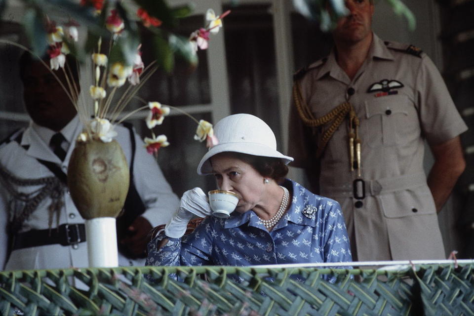 The Queen is an expert tea drinker, pictured in 1982. (Getty Images)