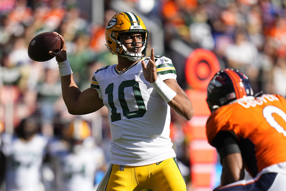 Green Bay Packers quarterback Jordan Love (10) passes against the Denver Broncos during the first half of an NFL football game in Denver, Sunday, Oct. 22, 2023. (AP Photo/Jack Dempsey)